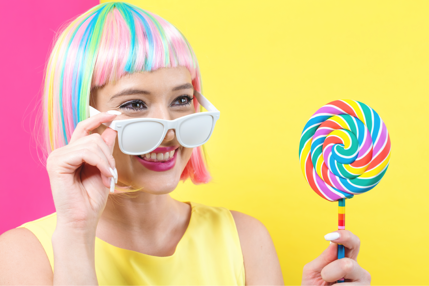 Young woman with a large lollipop
